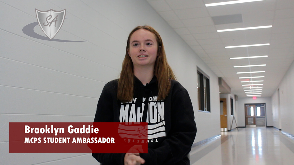 The words "Brooklyn Gaddie MCPS Student Ambassador" with picture of student in hallway